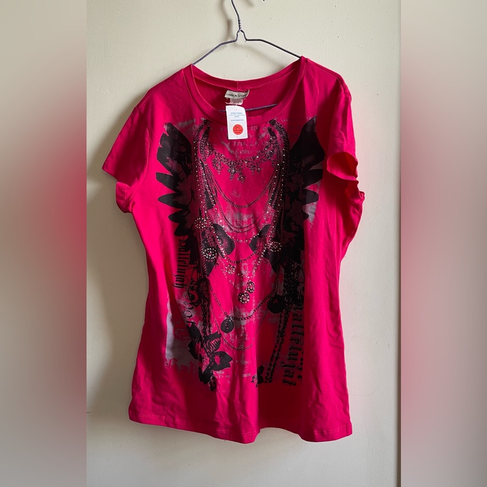 A beautiful bedazzled pink artsy summer shirt
